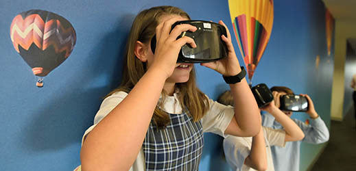 Students in hallway using VR devices